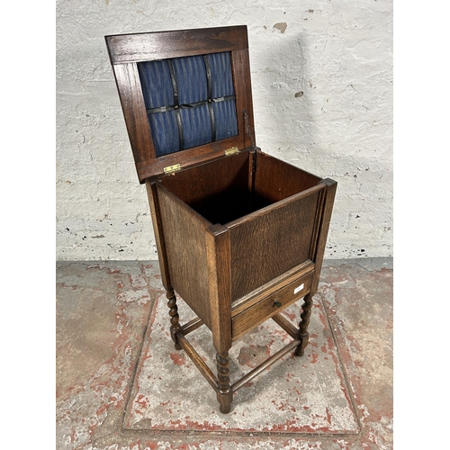 159 - A mid 20th century oak sewing cabinet on barley twist supports - approx. 73cm high x 40cm wide x 35c... 