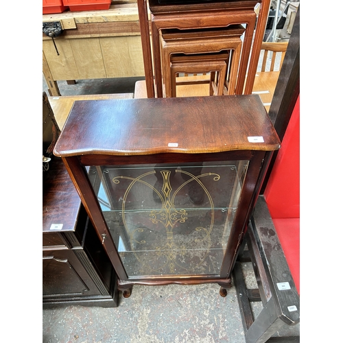 164 - A mahogany display cabinet with two glass shelves and cabriole supports