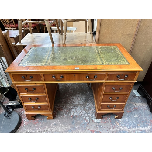 170 - A yew wood twin pedestal writing desk with green leather insert - approx. 76cm high x 122cm wide x 6... 