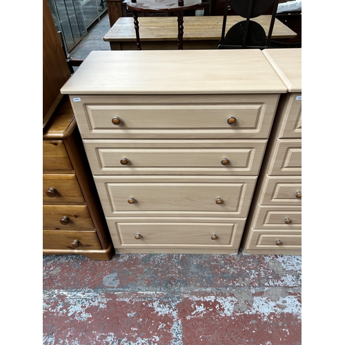 174 - A modern beech effect five piece bedroom suite comprising three chests of drawers and two double war... 