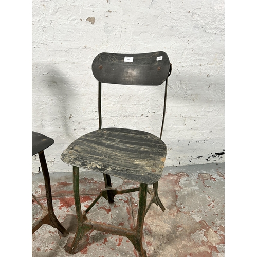 181 - A pair of 1950s Tan-Sad style fibreboard and cast metal industrial machinist's chairs