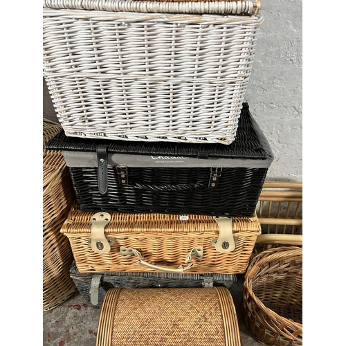 182 - Eleven pieces of wicker furniture to include magazine rack, baskets etc.