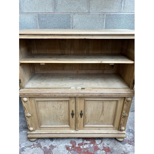 2 - A pine four door housekeeper's cupboard - approx. 144cm high x 55cm wide x 134cm deep