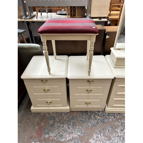 22 - Five pieces of white laminate bedroom furniture - three bedside chests of drawers, one bevelled edge... 