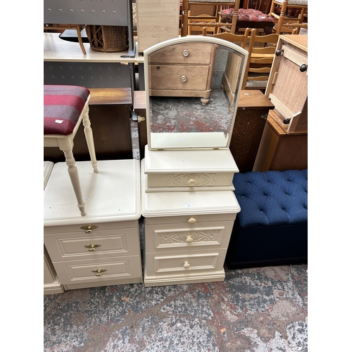 22 - Five pieces of white laminate bedroom furniture - three bedside chests of drawers, one bevelled edge... 