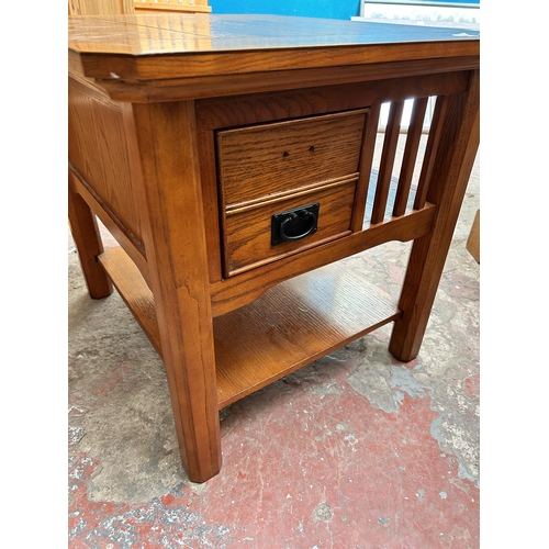 32 - A modern oak three tier coffee table with single drawer