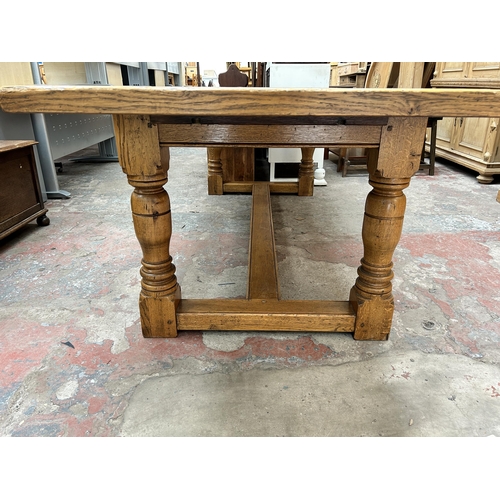 33 - A 17th century style solid oak refectory dining table - approx. 77cm high x 91cm wide x 244cm long