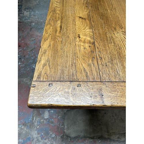 33 - A 17th century style solid oak refectory dining table - approx. 77cm high x 91cm wide x 244cm long