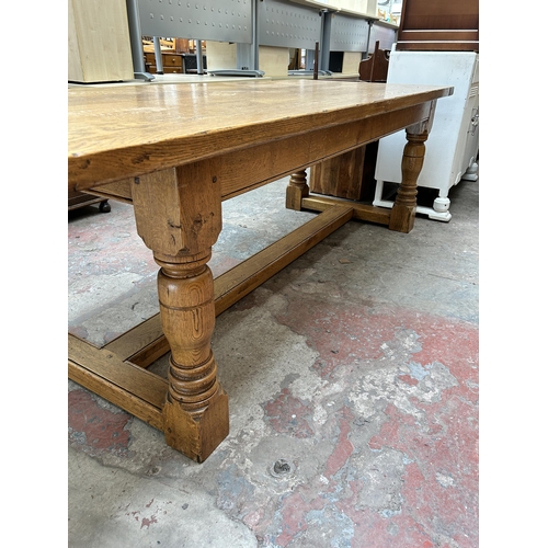 33 - A 17th century style solid oak refectory dining table - approx. 77cm high x 91cm wide x 244cm long