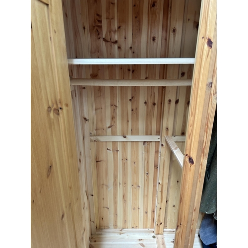 35 - A pine double wardrobe - approx. 187cm high x 120cm wide x 57cm deep