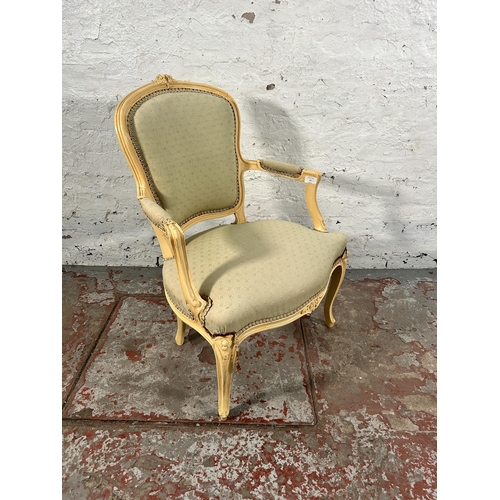 37 - A French Louis XVI style cream painted and green fabric upholstered open armchair