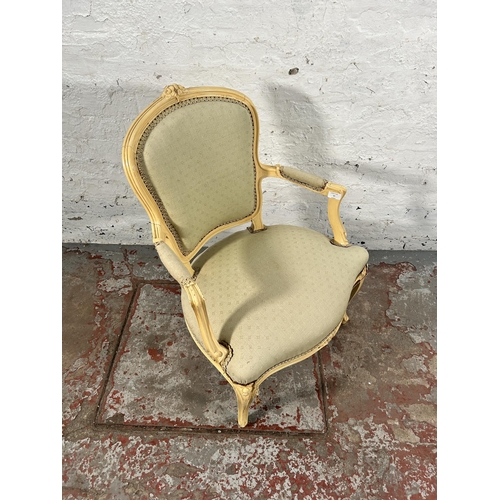 37 - A French Louis XVI style cream painted and green fabric upholstered open armchair