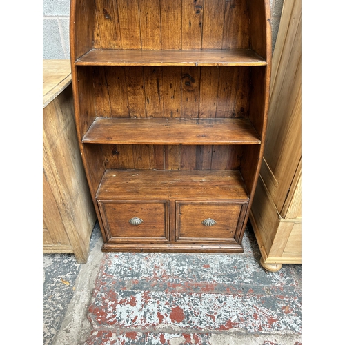 4 - A reclaimed pine boat shaped four tier bookcase - approx. 204cm high x 83cm wide x 32cm deep