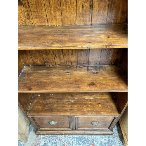 4 - A reclaimed pine boat shaped four tier bookcase - approx. 204cm high x 83cm wide x 32cm deep