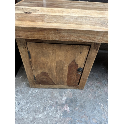 40 - An Indian sheesham wood rectangular coffee table - approx. 50cm high x 55cm wide x 141cm long