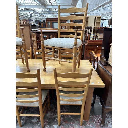 54 - A modern solid oak rectangular dining table and eight dining chairs - approx. 76cm high x 100cm wide... 