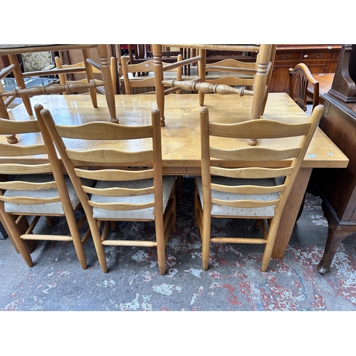 54 - A modern solid oak rectangular dining table and eight dining chairs - approx. 76cm high x 100cm wide... 