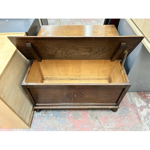 56 - A carved oak blanket box