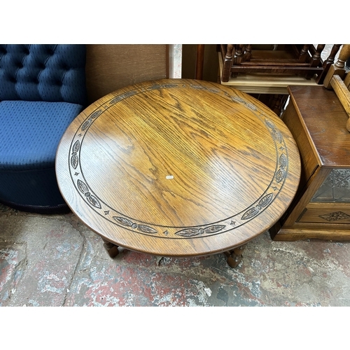 19 - Three pieces of oak furniture, nest of three tables, TV stand and circular coffee table