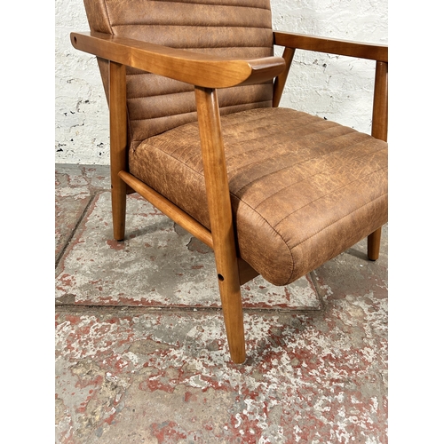 67 - A Dunelm Quinn tan faux leather and beech armchair - RRP £149.00