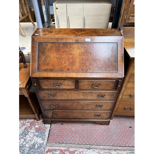 72 - A Georgian style burr walnut bureau