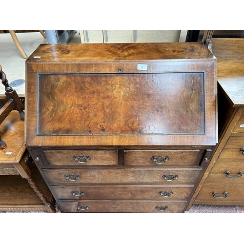 72 - A Georgian style burr walnut bureau