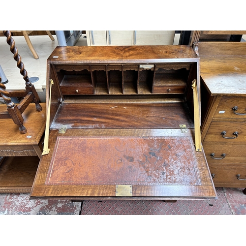 72 - A Georgian style burr walnut bureau