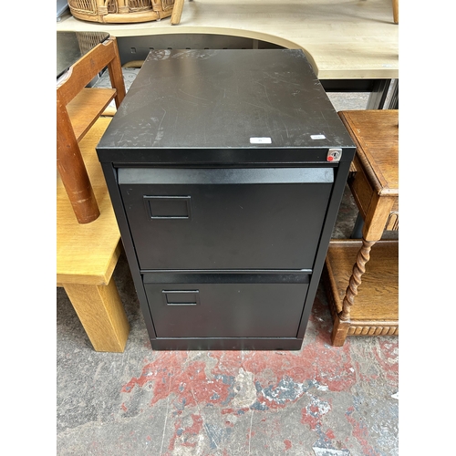 75 - A black metal two drawer office filing cabinet