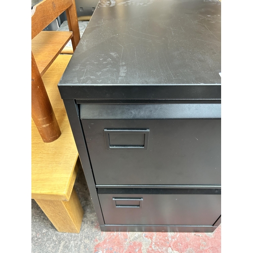 75 - A black metal two drawer office filing cabinet