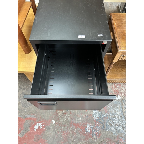 75 - A black metal two drawer office filing cabinet