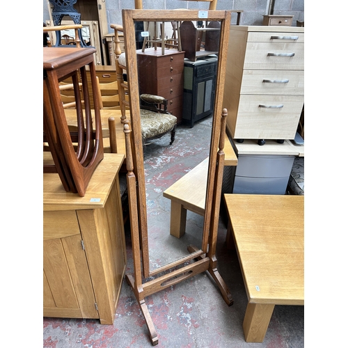 78 - An early 20th century oak cheval mirror - approx. 150cm high