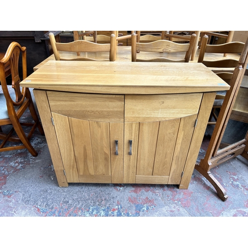 81 - A modern oak sideboard - approx. 86cm high x 110cm wide x 45cm deep