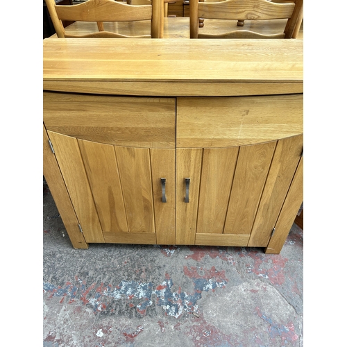 81 - A modern oak sideboard - approx. 86cm high x 110cm wide x 45cm deep