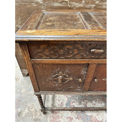 85 - A 1920s/1930s Fullotone carved oak gramophone cabinet with fitted gramophone