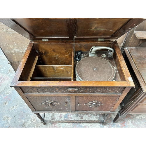 85 - A 1920s/1930s Fullotone carved oak gramophone cabinet with fitted gramophone