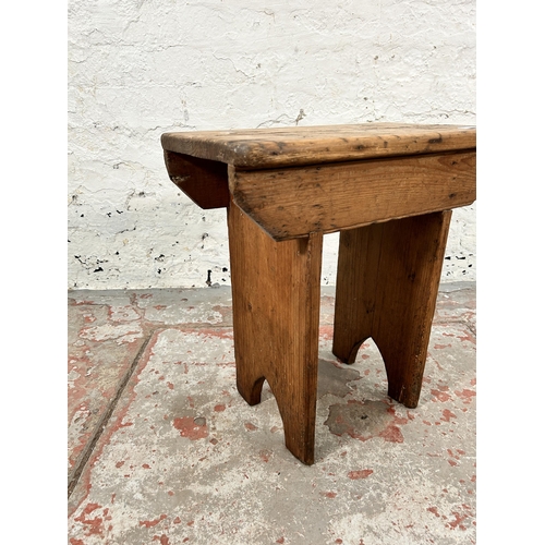 9 - A late 19th/early 20th century pine farmhouse stool - approx. 45cm high x 44cm wide x 25cm deep