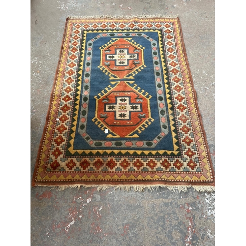 100 - An Eastern Kayam OCM 100% wool pile rug hand knotted in Turkey - approx. 193cm x 129cm