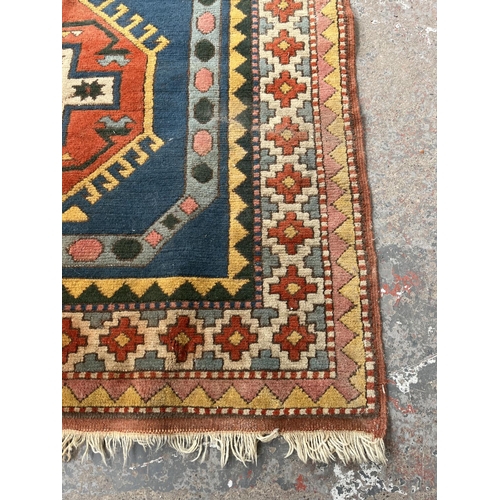 100 - An Eastern Kayam OCM 100% wool pile rug hand knotted in Turkey - approx. 193cm x 129cm