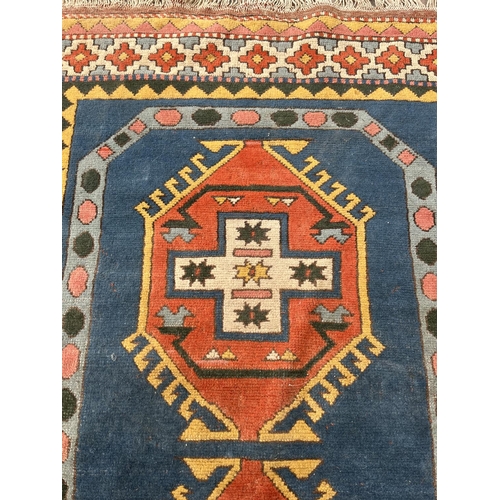 100 - An Eastern Kayam OCM 100% wool pile rug hand knotted in Turkey - approx. 193cm x 129cm