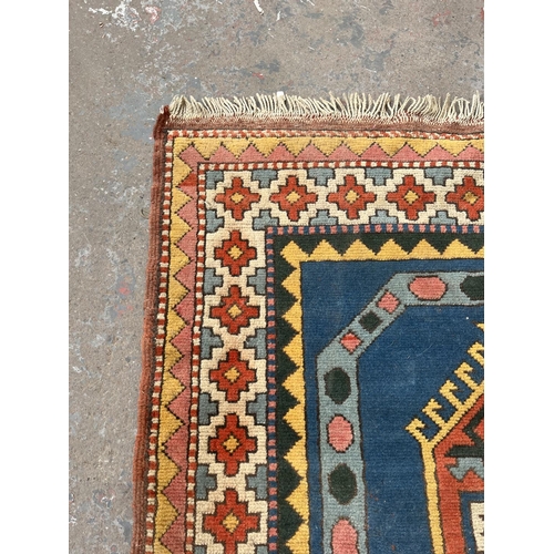 100 - An Eastern Kayam OCM 100% wool pile rug hand knotted in Turkey - approx. 193cm x 129cm