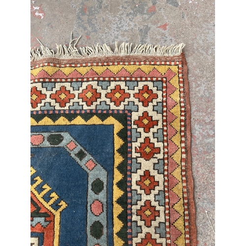 100 - An Eastern Kayam OCM 100% wool pile rug hand knotted in Turkey - approx. 193cm x 129cm