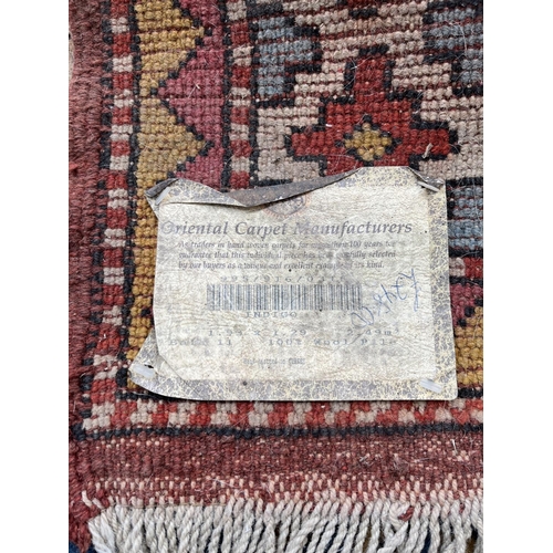 100 - An Eastern Kayam OCM 100% wool pile rug hand knotted in Turkey - approx. 193cm x 129cm