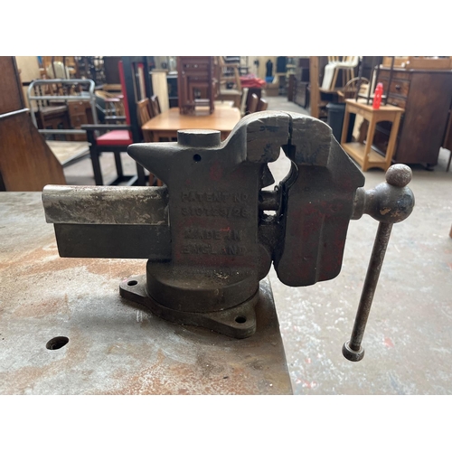 103D - A mid 20th century green painted steel work bench with fitted Record No. 74 vice - approx. 96cm high... 