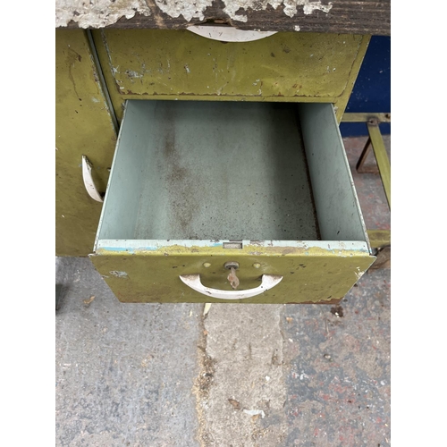 103D - A mid 20th century green painted steel work bench with fitted Record No. 74 vice - approx. 96cm high... 