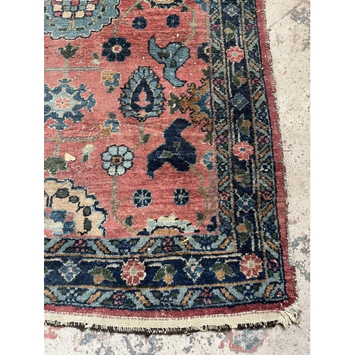 27 - A hand knotted rug - approx. 154cm x 100cm