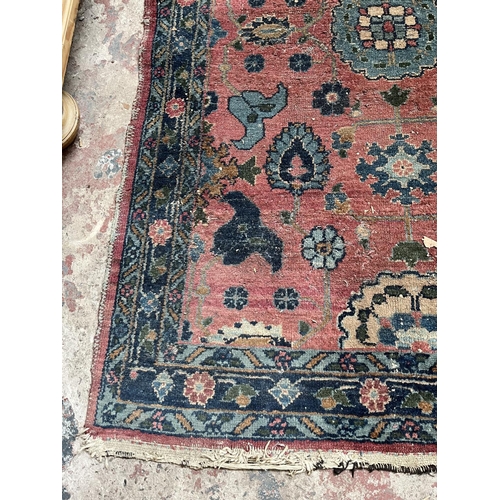 27 - A hand knotted rug - approx. 154cm x 100cm