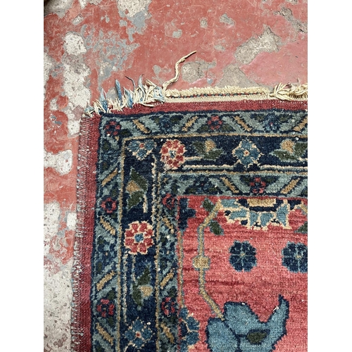 27 - A hand knotted rug - approx. 154cm x 100cm