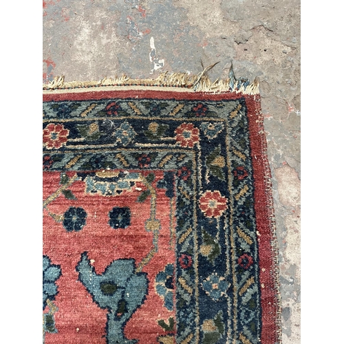 27 - A hand knotted rug - approx. 154cm x 100cm