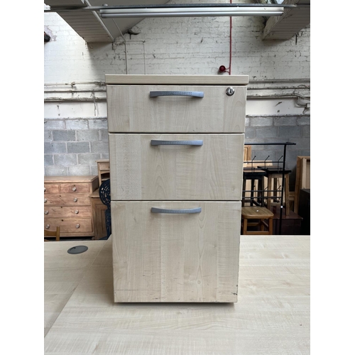 64 - A modern beech effect office desk and three drawer filing cabinet