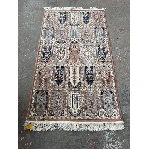 93 - A 100% wool pile rug made in Pakistan - approx. 165cm x 96cm